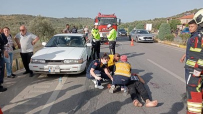 Burhaniye'de motosiklet otomobile çarptı