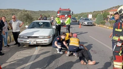 Burhaniye'de motosiklet otomobile çarptı